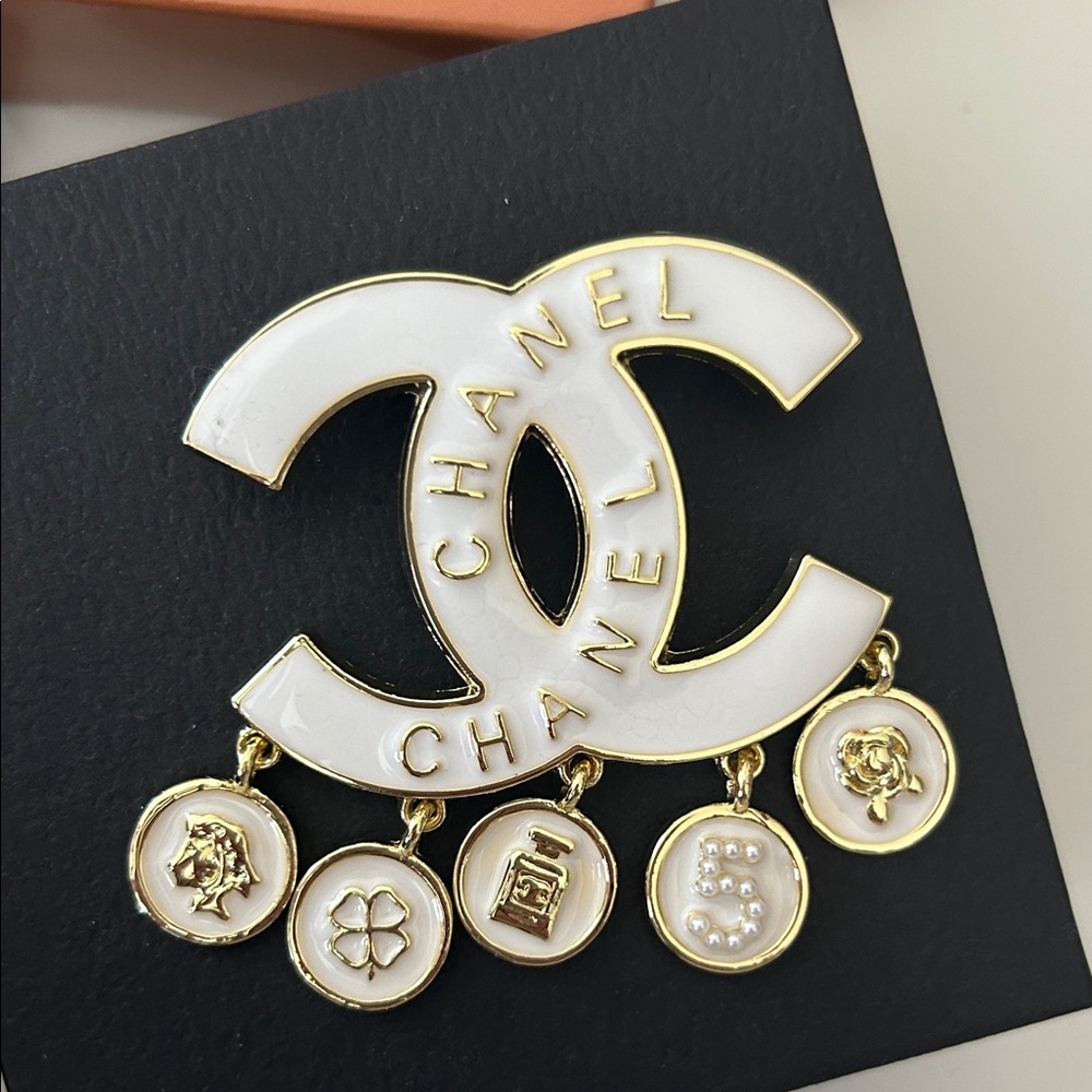 CHANELLY Gold and Cream Logo Brooch